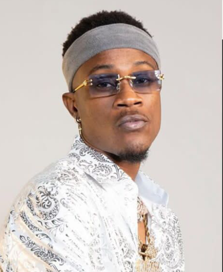 “I Wish I Never Left Nigeria”: Rapper Dotman’s Painful Confession Sends Shockwaves Through Fans
